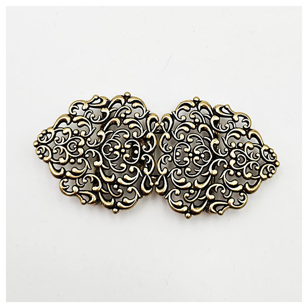 Dirndlschließe aus Metall altgold 72mm/36mm